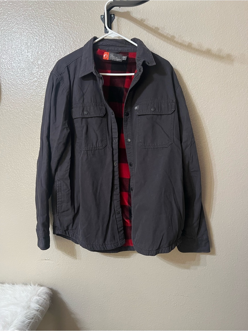 The American Outdoorsman Men's Black Shacket w/Red Plaid flannel lining. Sz-LG.